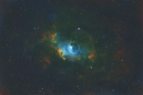 NGC 7635, commonly known as the Bubble Nebula and cataloged as Sh 2-162 and Caldwell 11, is an emission nebula in Cassiopeia. The prominent bubble is shaped by the stellar wind from the massive hot star SAO 20575, which pushes into the surrounding molecular cloud and ionized hydrogen region. The object lies near the open cluster Messier 52 and is generally placed at roughly 7,000 to 11,000 light years from Earth, depending on the distance estimate used for the surrounding complex. | Equipment: Celestron HD8, ZWO ASI6200MMP, Antlia Pro 3nm SHO, 4h 25m integration, 10/15/2025